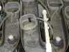 Flow-through system for cups which contain Tubifex worms.